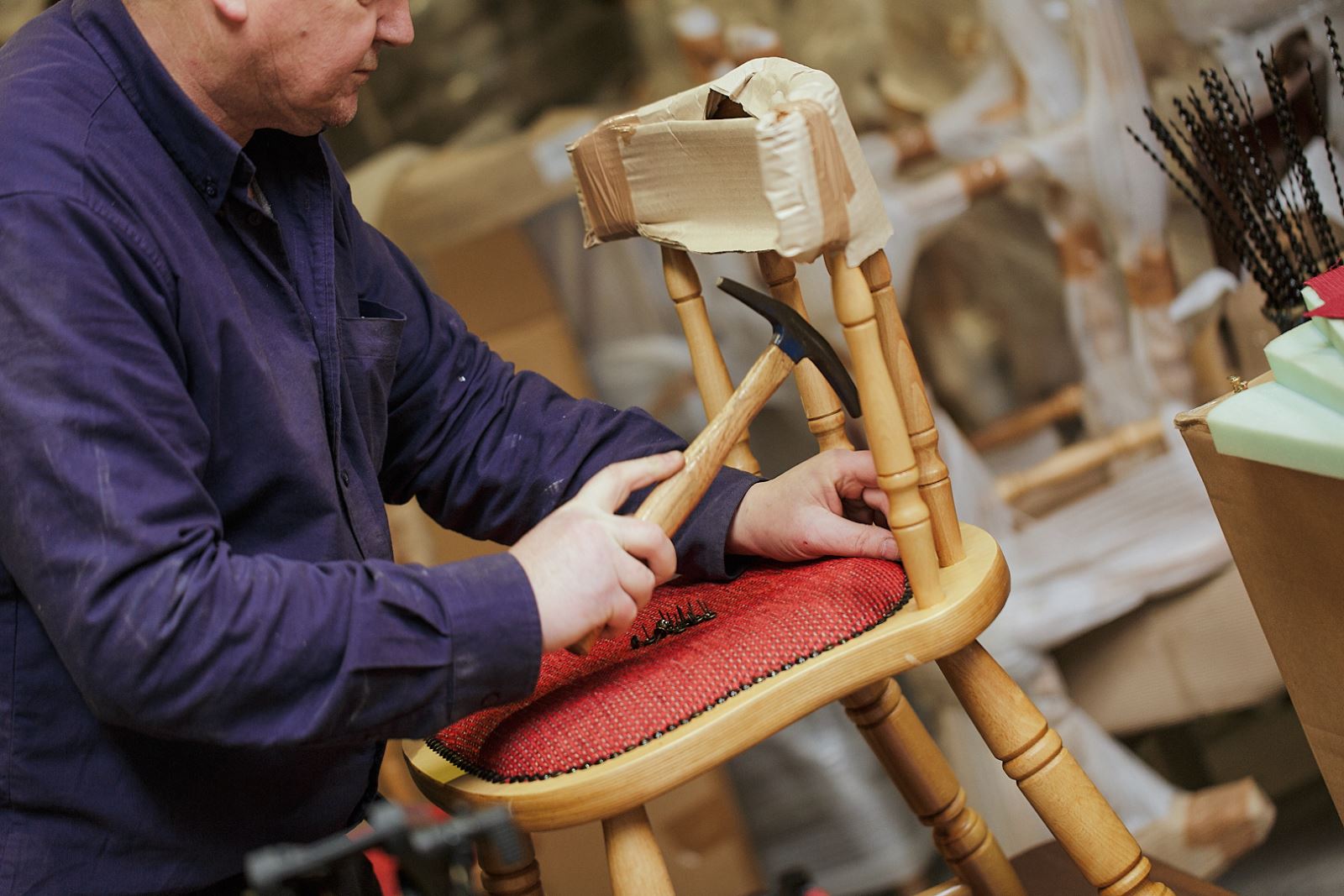 Expert upholsterers finishing chairs