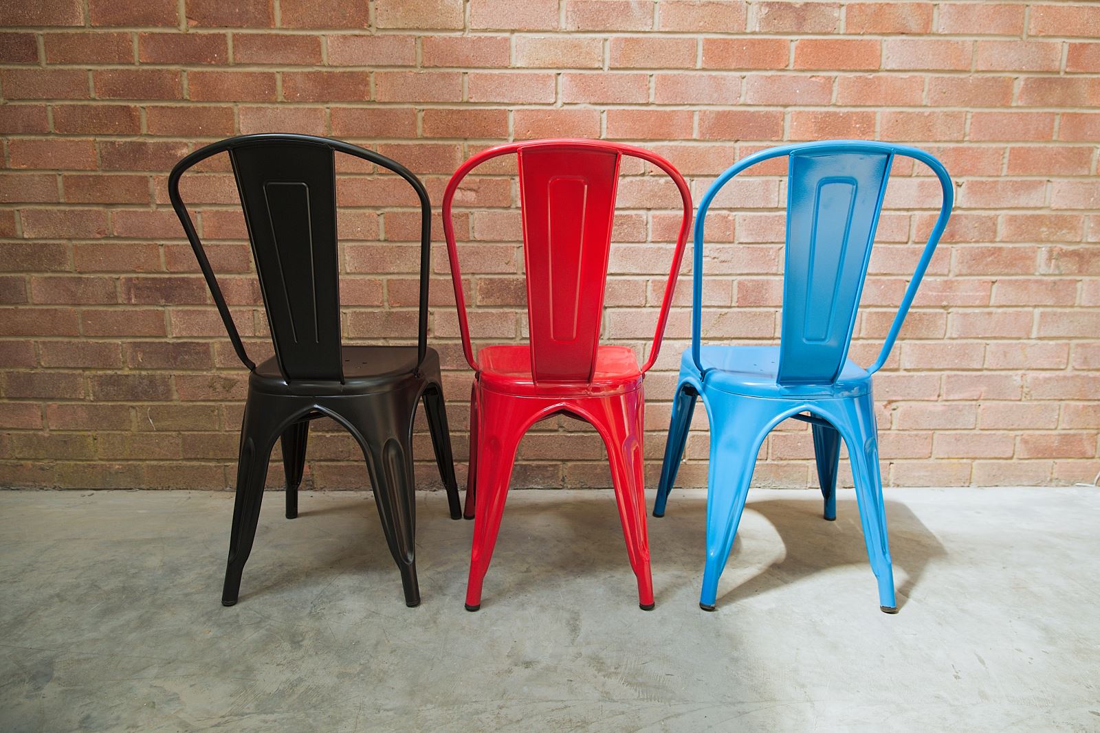Coloured metal stack chairs - Trent Furniture