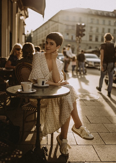 Woman sat outside coffee shop