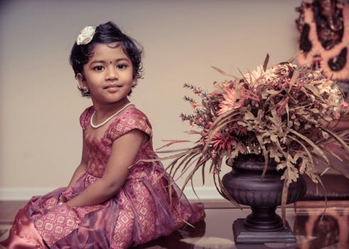 Young Indian child posing at Indian wedding event